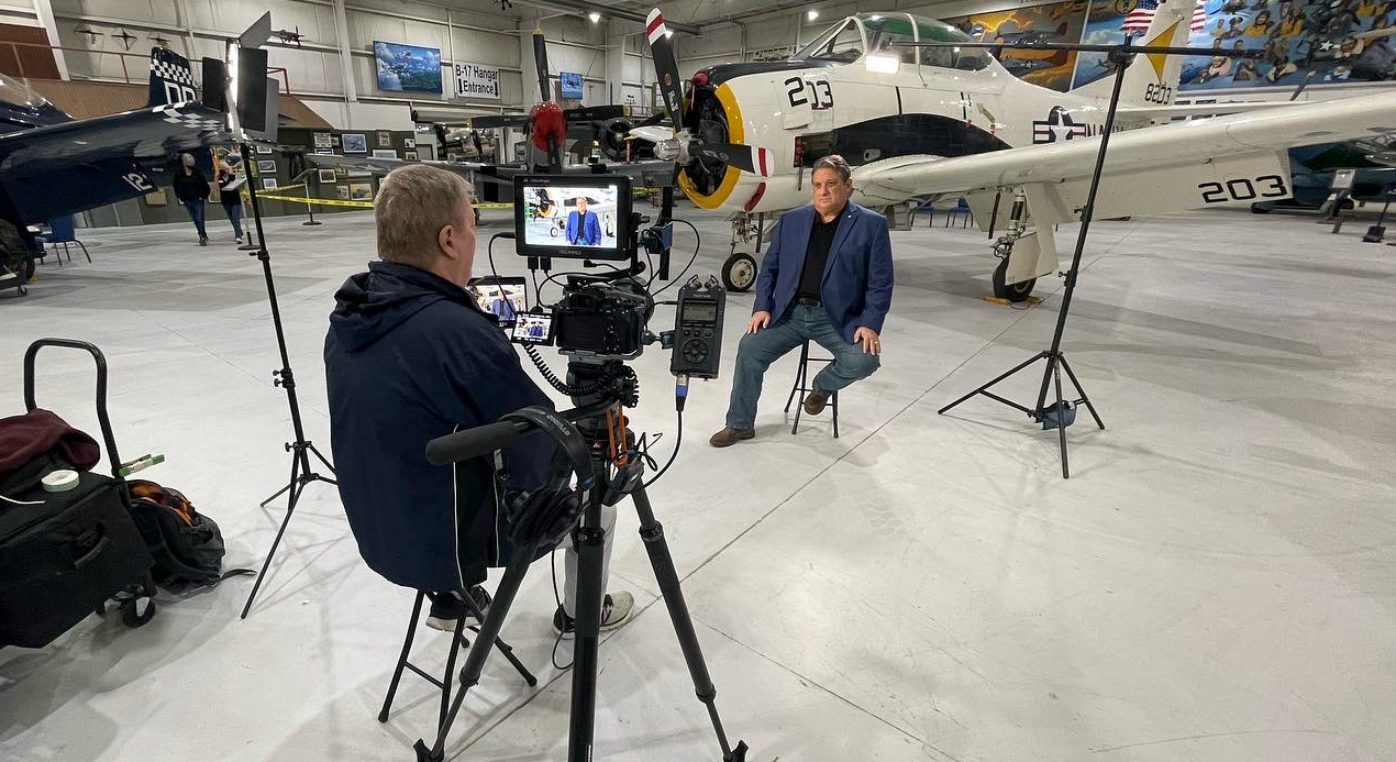 Bruce Feagle filming an interview at the Palm Springs Air Museum
